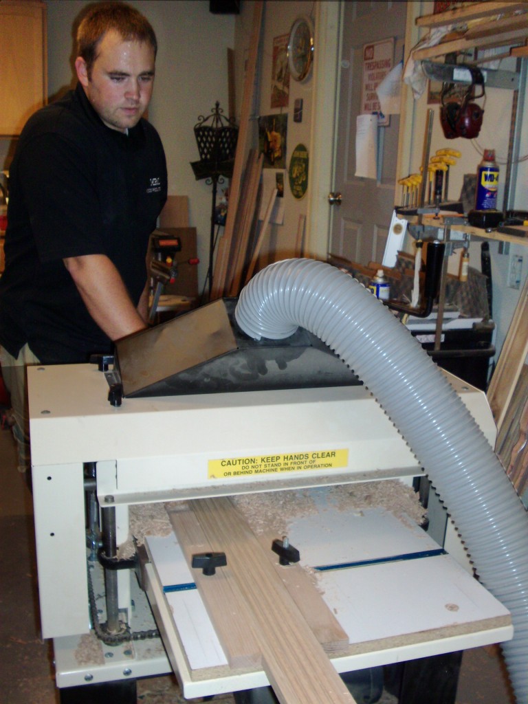 Here's the young entrepreneur hard at work toward  his next $96,000 thanks to his ingenuity, dedication, hard work...and his Woodmaster Molder/Planer.