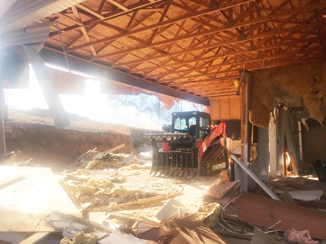Darrell Bice doesn't fool around. He started his home remodeling job with a skid-steer. He demolished much of the building, leaving the truss roof structure intact. Then built his new home beneath it!