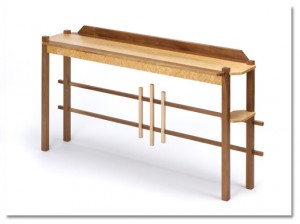 Bruce's Hall/Entry table is made of birdseye maple and walnut. It measures 34" H x 67" L x 16" W.