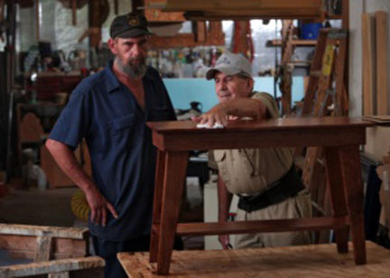 Ricky Hatfield, left, learns the art of woodworking from Ralph Jones. Hatfield, 42, lost his job as a truck driver, the only career he has had. He said he is enjoying learning the new trade.