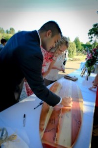 "Please be sure to sign our...surfboard!" Guest books are so yesterday. Guests at weddings and affairs sign one of Dana's surfboards.